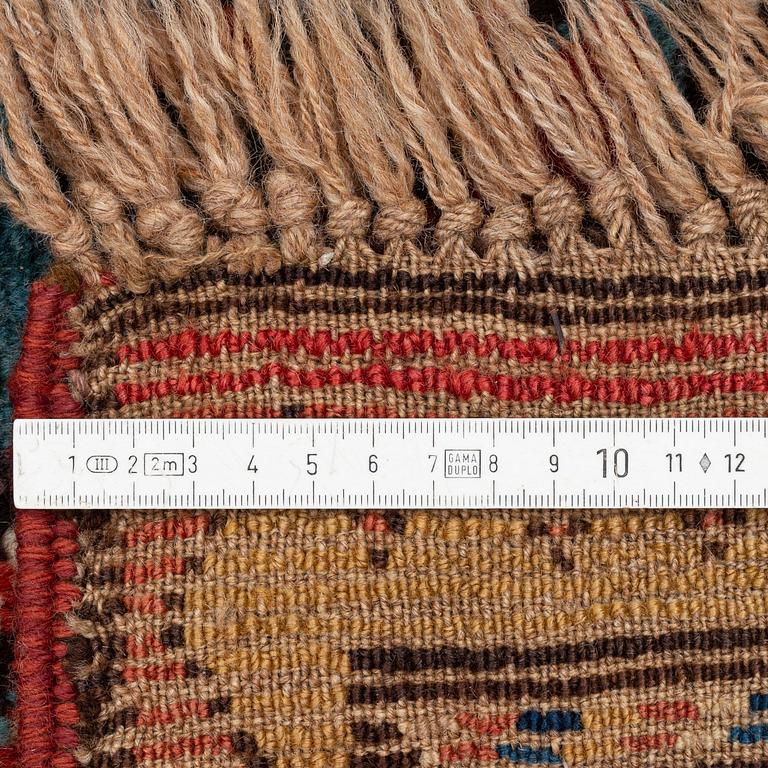 An antique Gendje rug, south Caucasus, c. 208 x 103 cm.