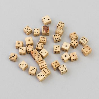 A COLLECTION OF 32 BONE MINIATURE DICE, 19th century.