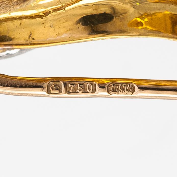 An 18K gold horse brooche with diamonds ca. 0.04 ct in total. United Kingdom.