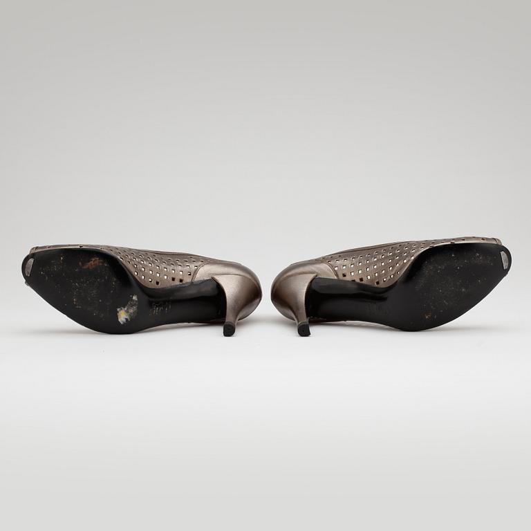 CHARLES JOURDAN, a pair of silver coloured leather pumps.