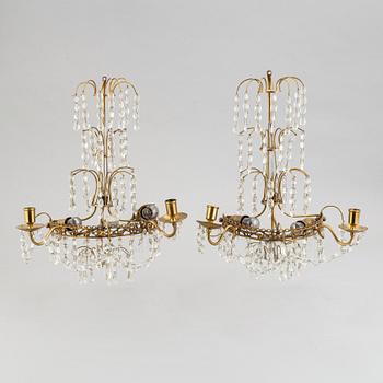 A pair of brass wall sconces, first half of the 20th century.