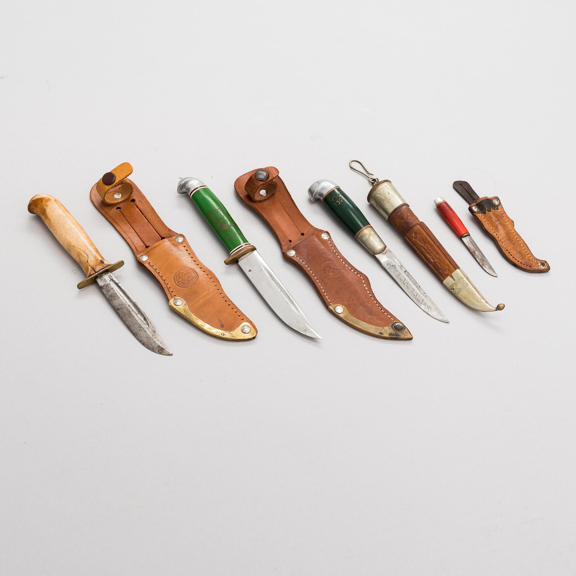 A set of four puukko knives and leather sheats, marked Olympia Helsinki -52.