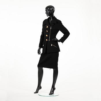 CHANEL, a two-piece suit consisting of jacket and skirt.