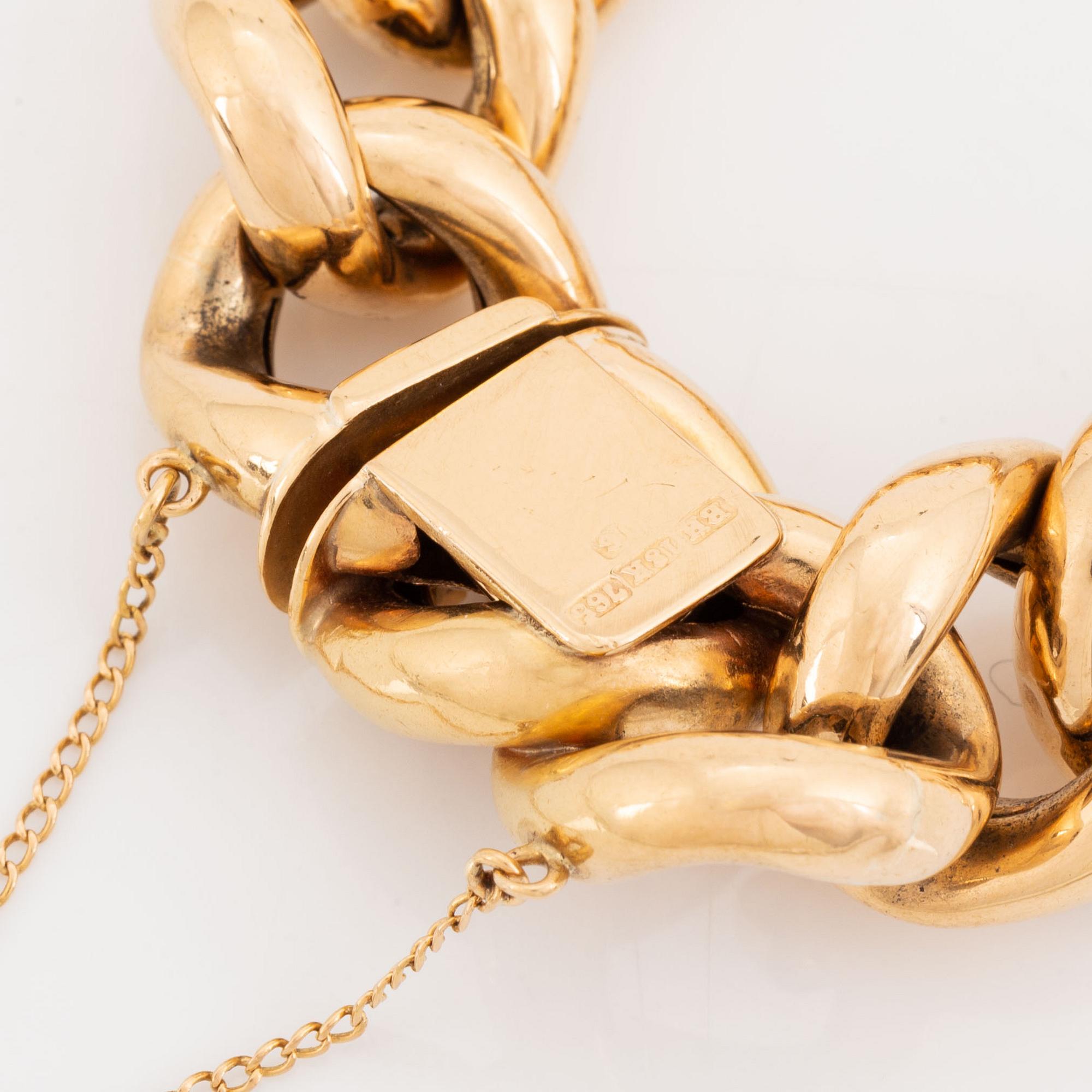 An 18K gold bracelet.