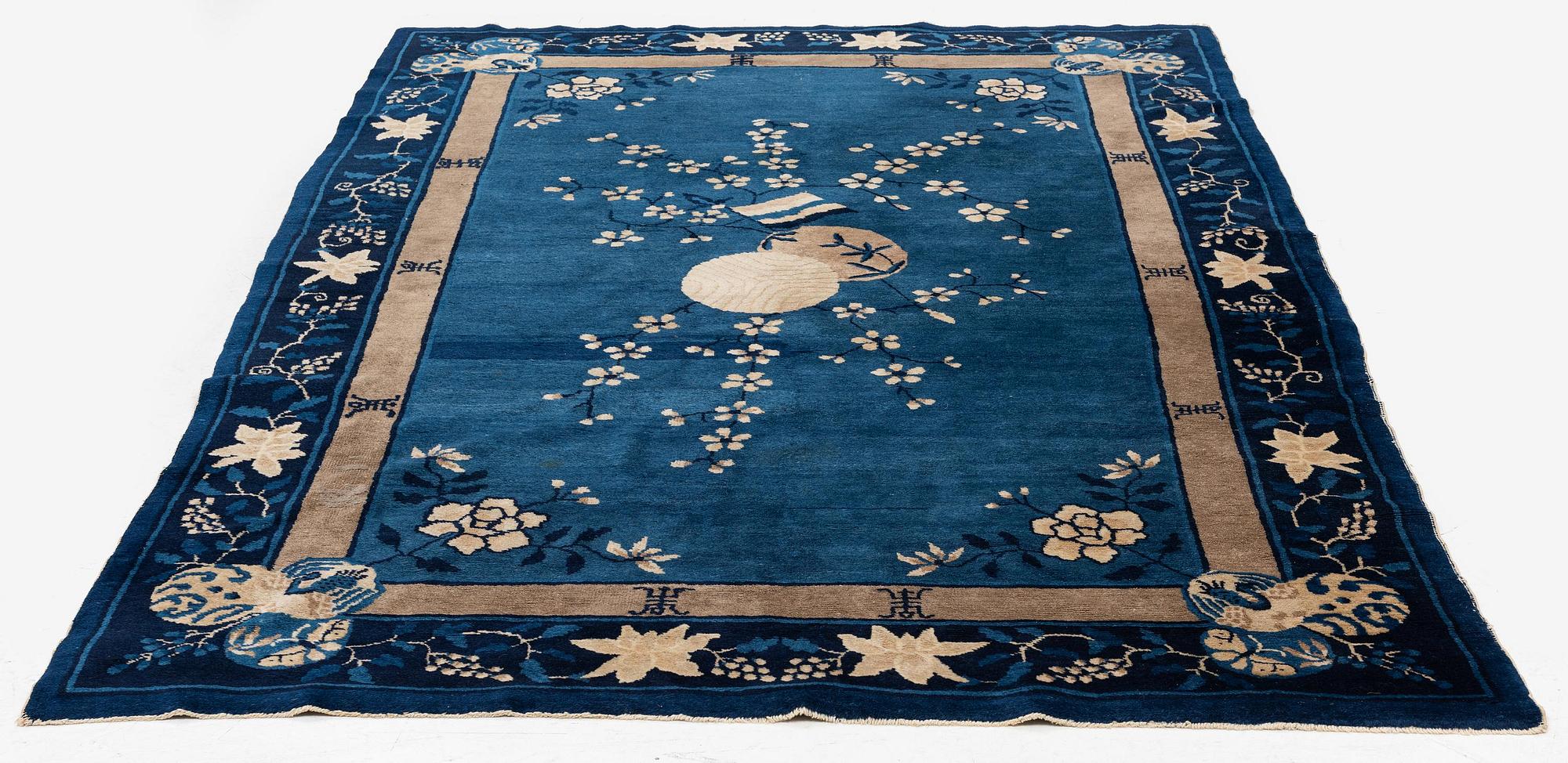 An antique rug, probably Beijing, northern China, around 1910, c. 235x150 cm.