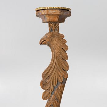 A carved wood floor candlestick, circa 1900 composed of 18th century elements.