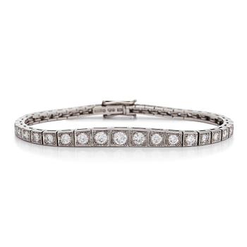A platinum bracelet with brilliant-cut diamonds.