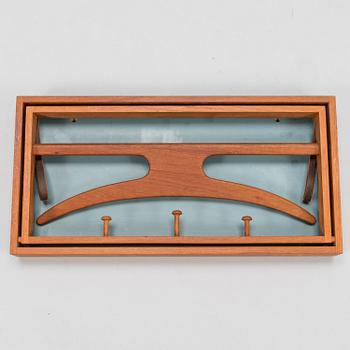 A mid-20th-Century Danish clothes rack by Adam Hoff & Poul Östergaard, Virum Möbelsnickeri.