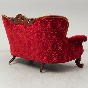 A later part of the 19th century Rococo style sofa.