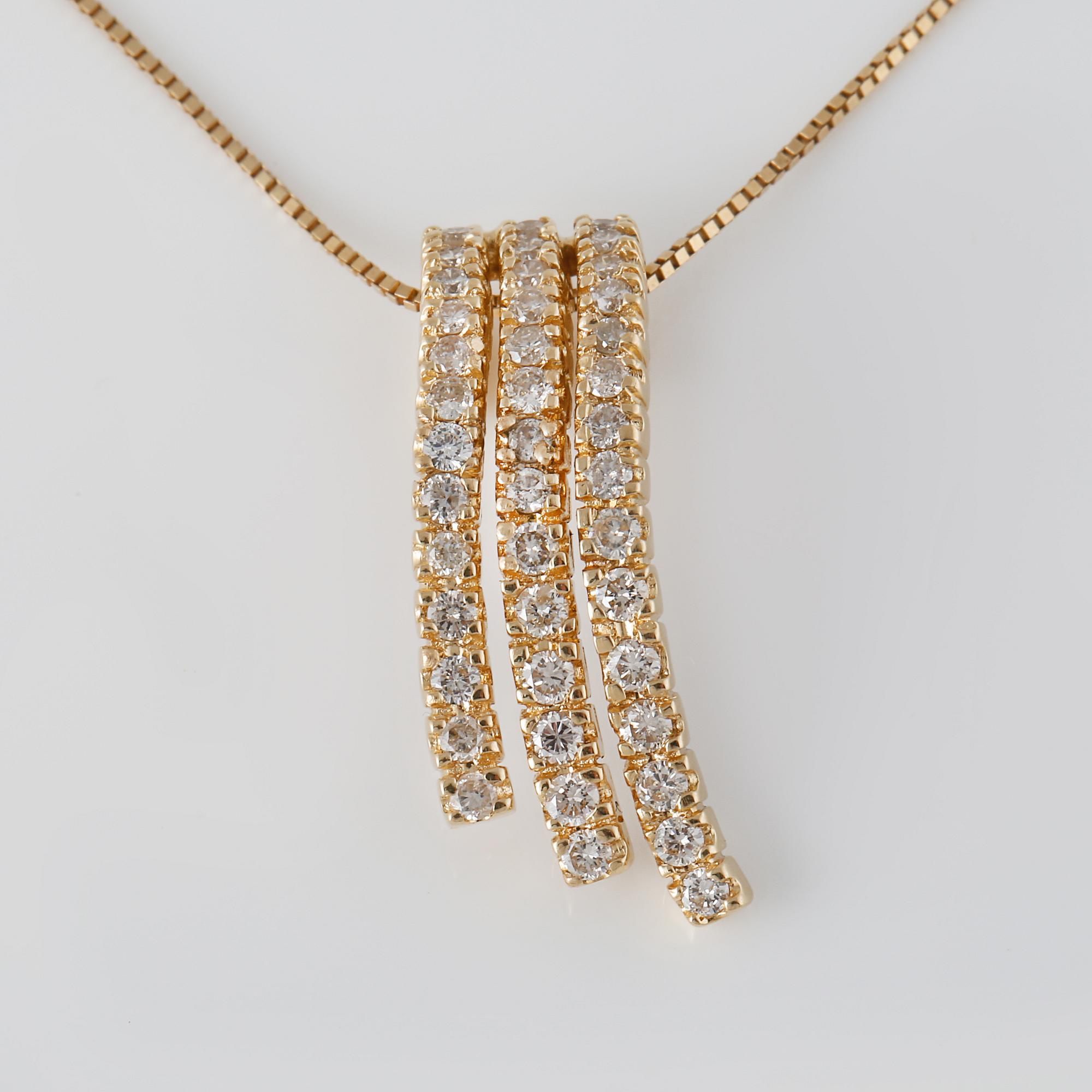HÄNGE , 14K guld med briljantslipade diamanter ca 1.20 ct. Vikt 5,4 gram.