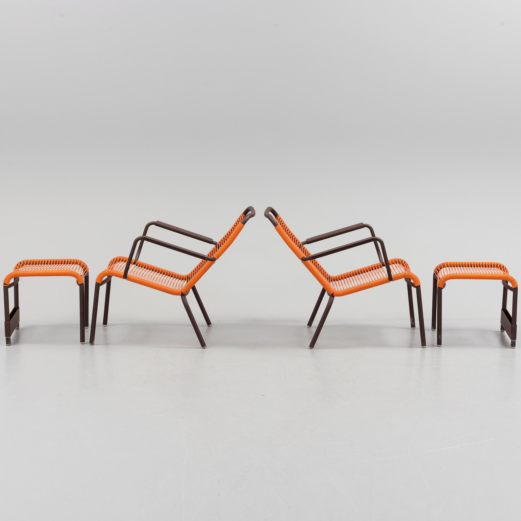a pair of FRÉDÉRIC SOFIA "Saint Tropez" lounge chairs with footstools, by Fermob.