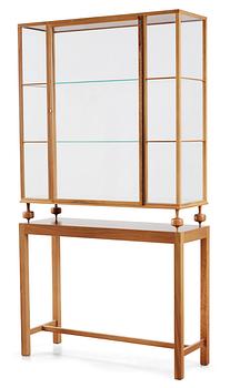 A Josef Frank walnut showcase cabinet, Svenskt Tenn, model 2077.