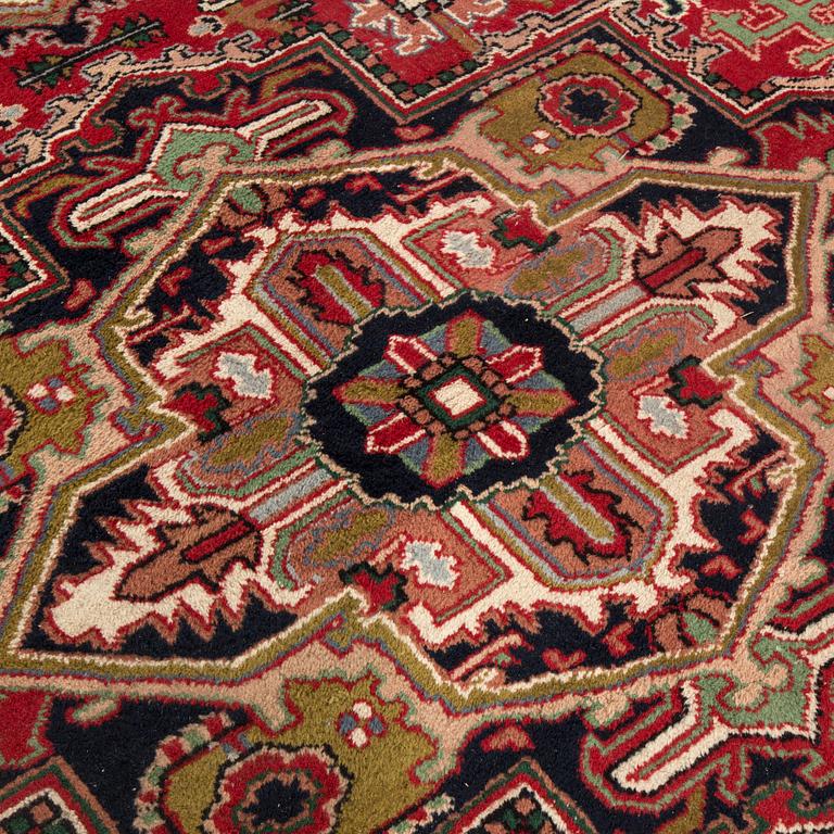 A semi-antique carpet from Eastern Europe, around 335 x 244 cm.