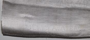 A TABLE CLOTH AND NAPKINS, 24 pieces, linen damask, the table cloth is dated 1827, ca 560-567 x 207,5 cm, Sweden 1827.