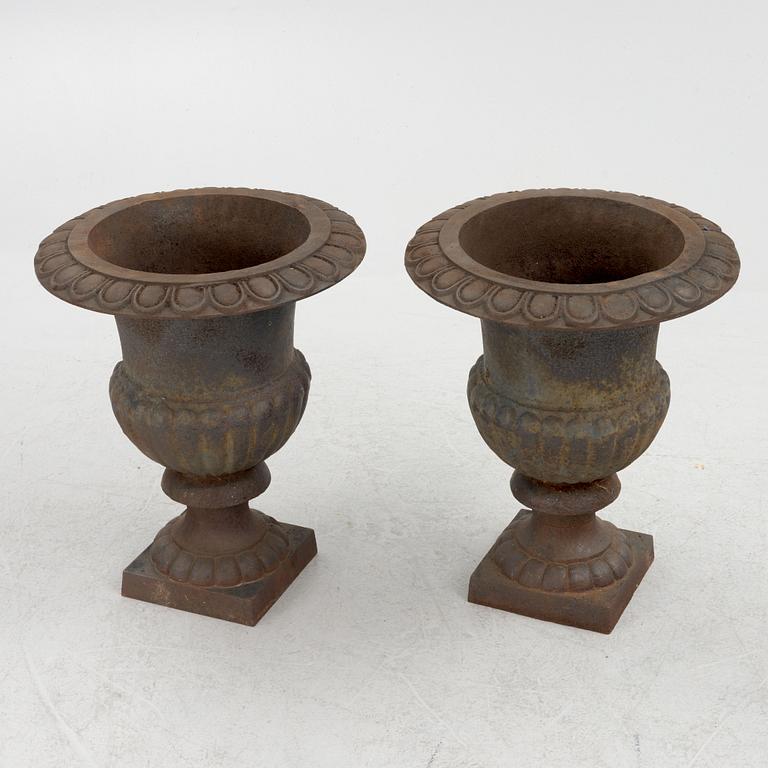 A pair of cast iron planters, 20th Century.