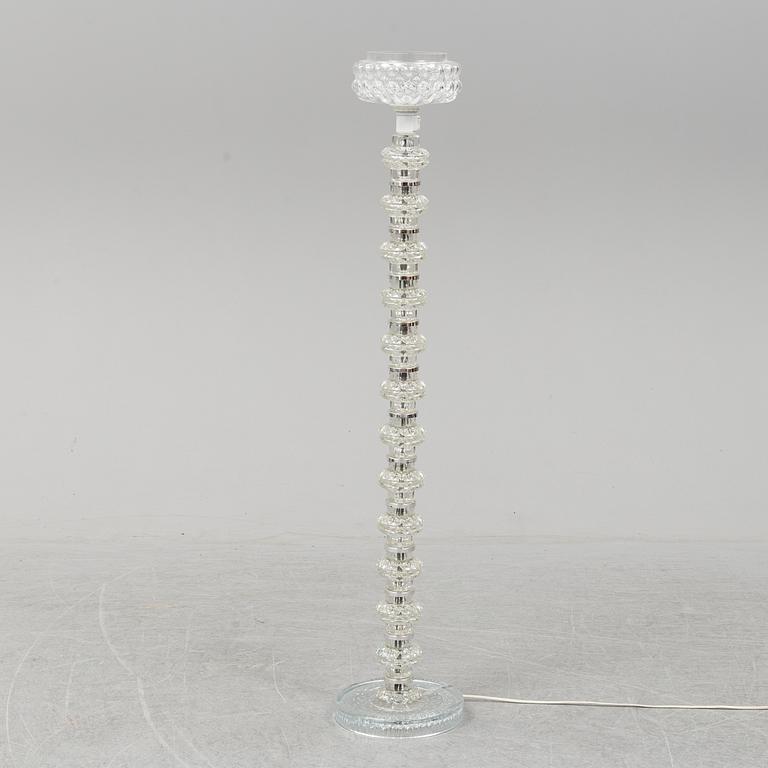 A glass floor lamp.