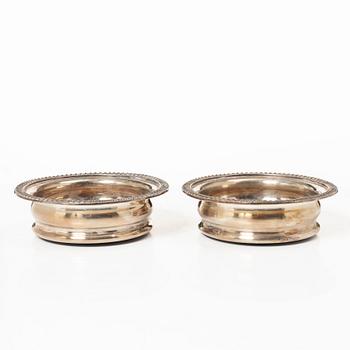 A pair of bottle coasters, silverplate, England.