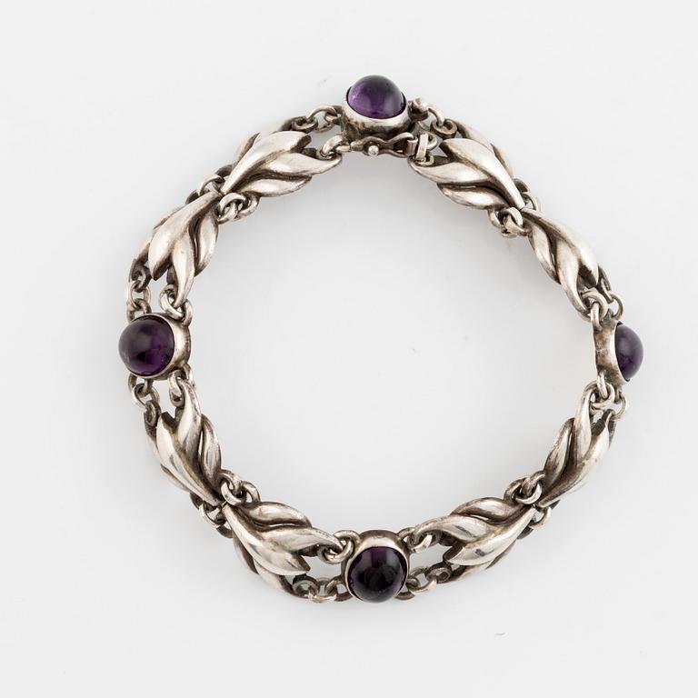 Georg Jensen, a silver bracelet set with cabochon-cut amethysts.