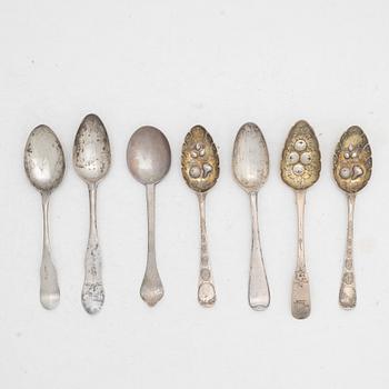 Seven silver spoons, including English and Swedish hallmarks.