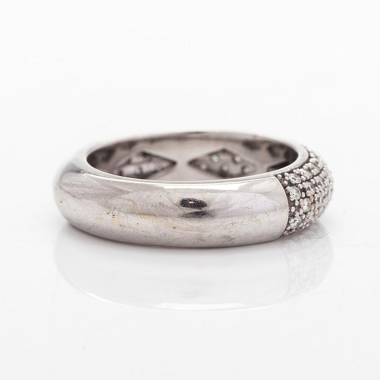 A 14K white gold ring with diamonds.