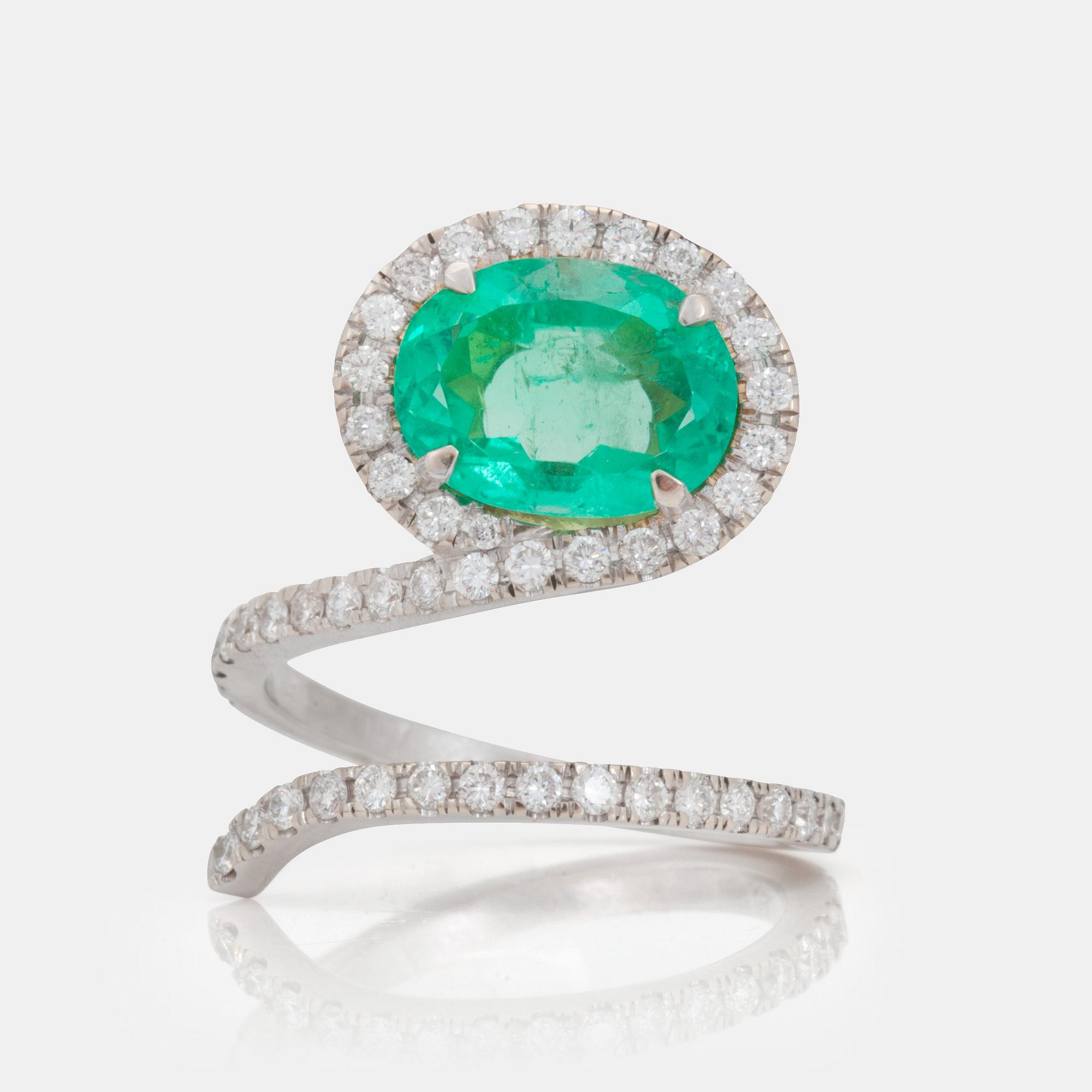 A 2.97ct emerald and brilliant cut diamond ring.