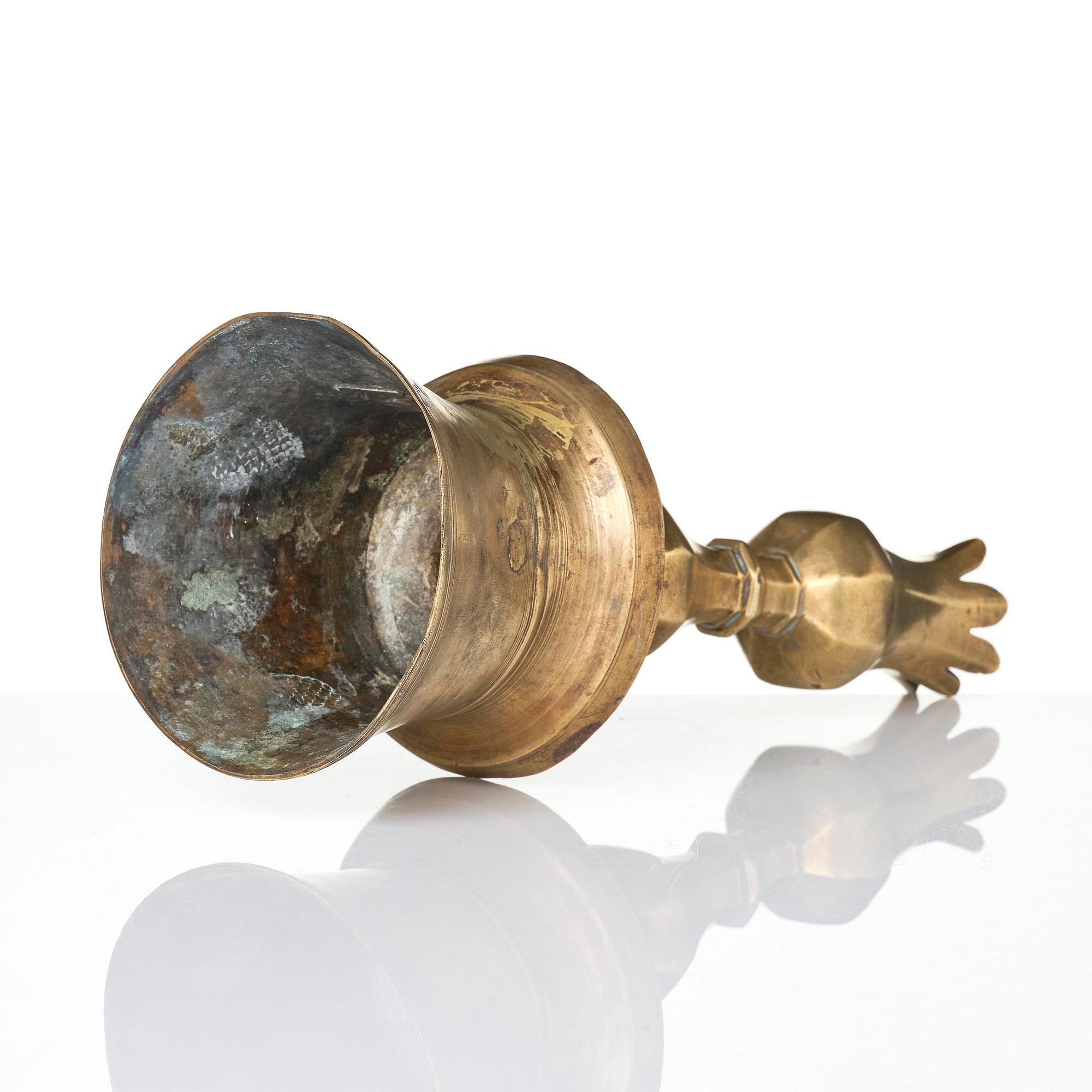 An Ottoman brass 'Tulip' Candelstick, Turkey, 17th/18th century.