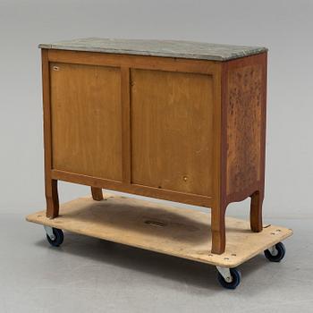 A 20th century rococo style chest of three drawers.