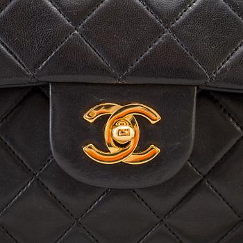 A "Double Flap bag" by Chanel.
