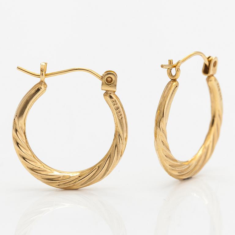 A pair of 14K gold earrings.