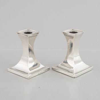 A pair of silver candlesticks, mark of William Hutton & Sons Ltd, Sheffield 1911-1912.