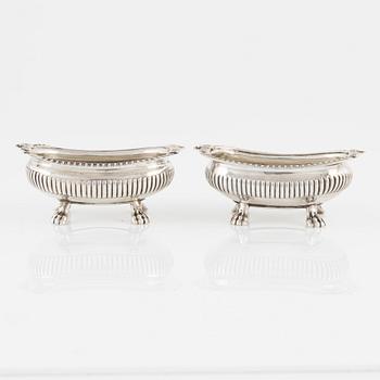 A pair of English Silver Salt Cellars, marks ofJoseph Angell Il 1823 and Samuel Dutton 1826 respectively, London.