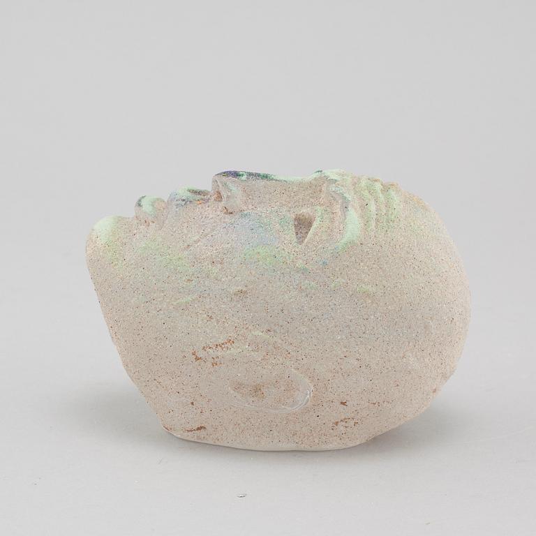 a glass object, signed.