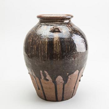 A South East Asian brown and black glazed jar, 14th/17th Century.