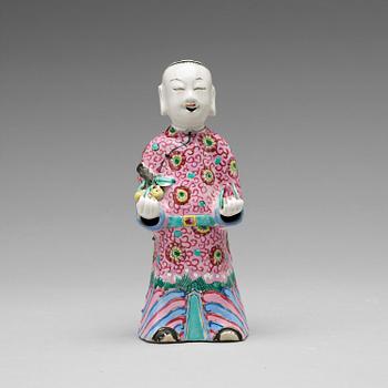 A famille rose figure of a laughing boy, Qing dynasty, circa 1800.