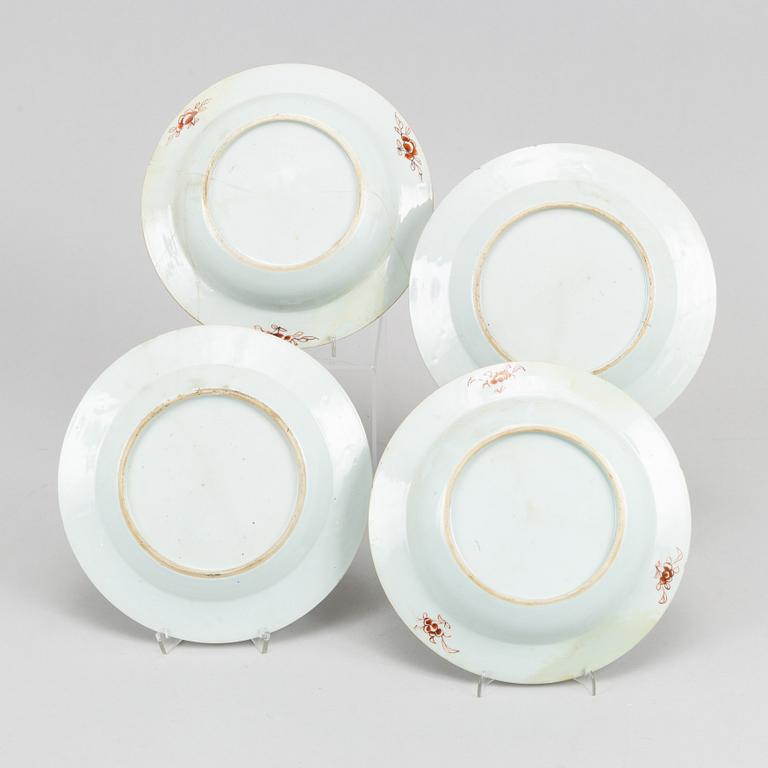A set with four famille rose dinner plates, Qing dynasty, Qianlong (1736-95). (2+2).