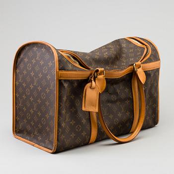 LOUIS VUITTON, a monogram canvas dog bag.