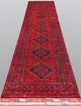 An Afghan runner, c. 390 x 91 cm.