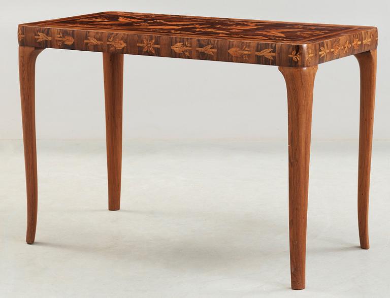 A Carl Malmsten mahogny table with inlays of different exotic woods, Sweden 1935.