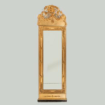 A rococo revival giltwood and parcel-gilt mirror, later part of the 19th Century.
