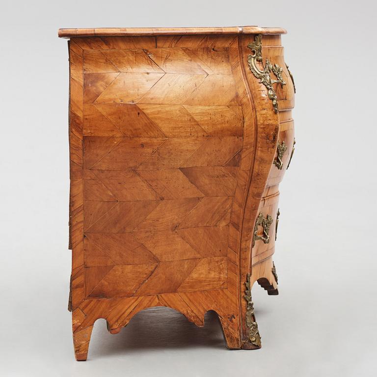 A brass-mounted and marquetry rococo commode, later part of the 18th century.