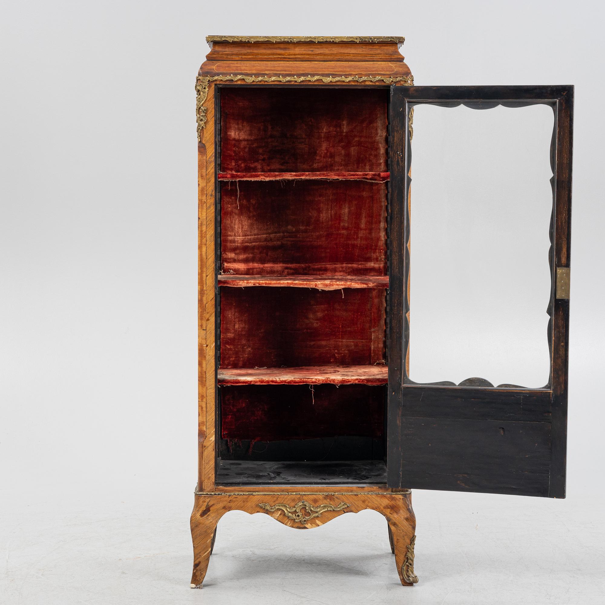 A 19th century, Rococo style display cabinet.