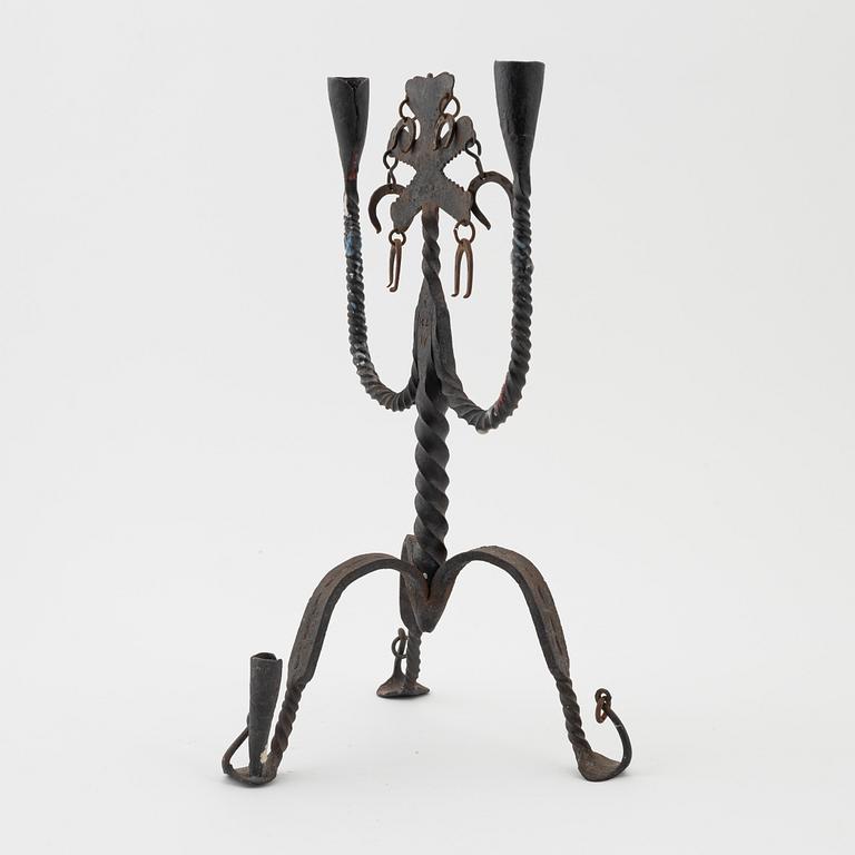 A Seedish wrought-iron three-light candlestick, circa 1900.