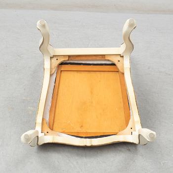 A dining table width twelve chairs, first half of the 20th century.