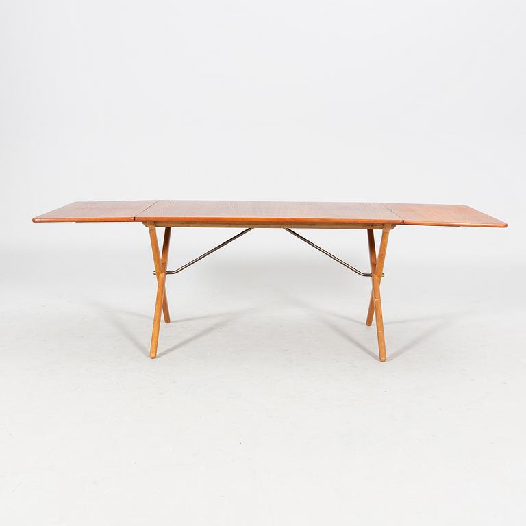 A Hans J Wegner "Savbukkebordet AT-303", teak and oak drop-leaf dining table, Andreas Tuck, Denmark 1950s-1960s.