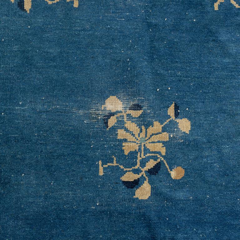 An antique Chinese carpet, c. 355 x 270 cm.