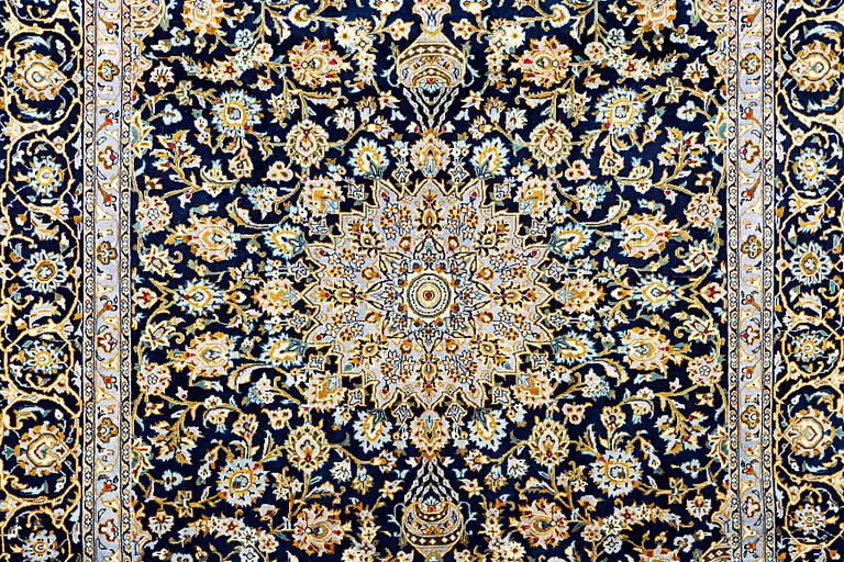 A Kashan carpet, c. 343 x 236 cm.