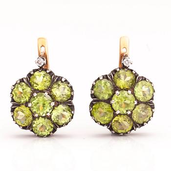 A pair of 14K gold and silver earrings with peridotes and diamonds ca. 0.06 ct in total. Moscow.