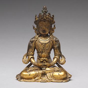 A gilt bronze figure of Amitayus buddha, Tibeto-Chinese, 18th Century.