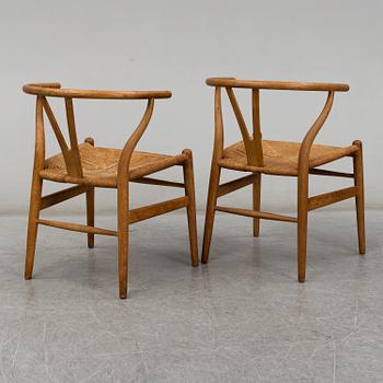 A pair of armchairs, 'Wishbone Chair' by Hans J Wegner, Carl Hansen & Son, Odense, Denmark.