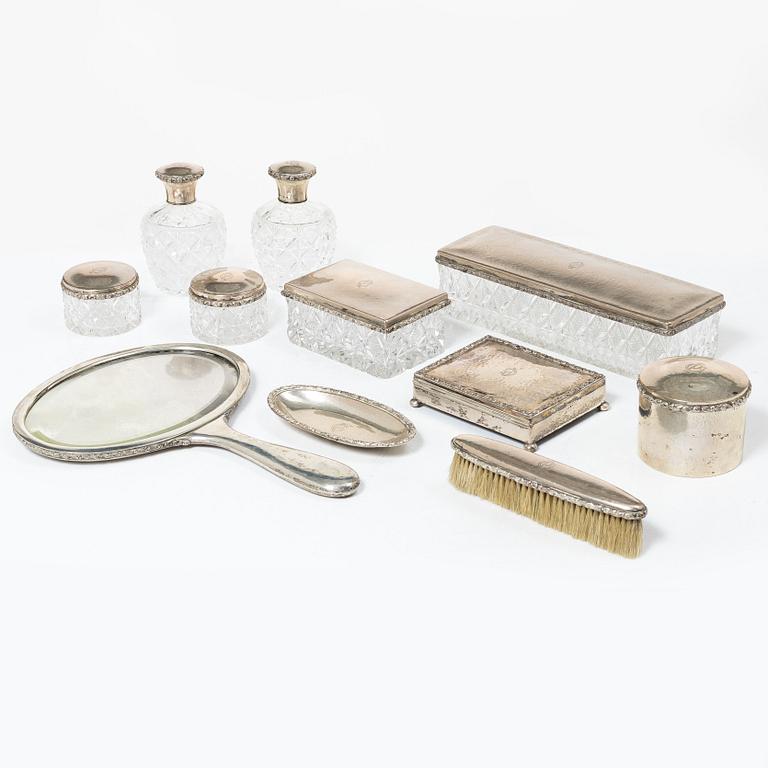 A K.Andersson silver and cut glass 'toilette set', monogrammed 'PG'. (11 pieces).